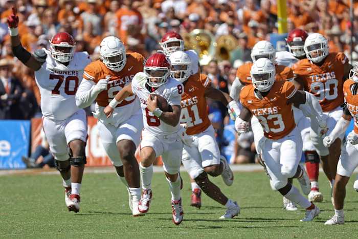 Oklahoma quarterback Dillon Gabriel carries the ball in the Red River Rivalry game against Texas.